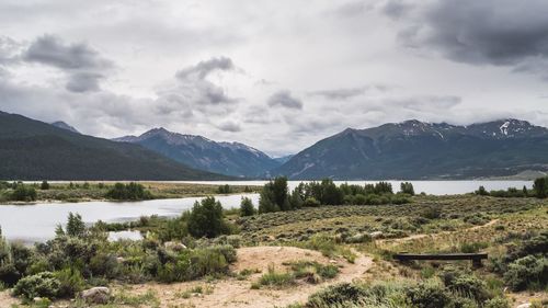 Scenic view of mountains against cloudy sky