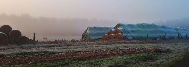 Panoramic view of field against sky during winter