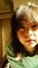 Close-up portrait of girl at home