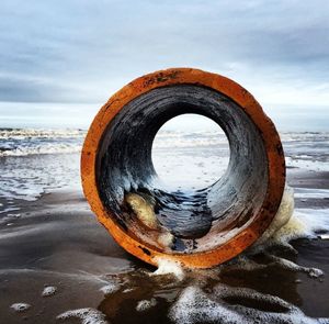 Scenic view of sea against cloudy sky