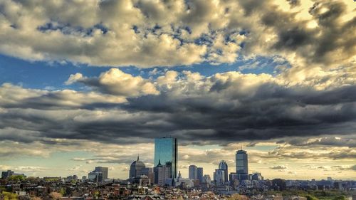 Modern buildings in city against sky