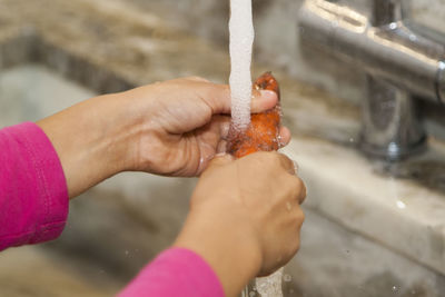 Close-up of hand holding ice cream