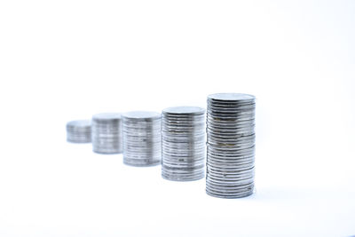 Close-up of coins on white background