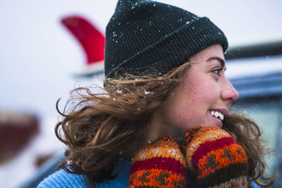 Woman surfer portrait with frozen surfboard