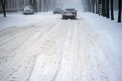 Cars on snow covered road during winter