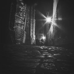 Full length of woman walking on illuminated street