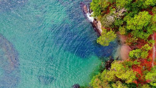 High angle view of rocks by sea