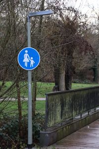 Road sign on wooden post