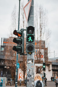 Close-up of road signal against sky