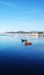 Sailboat on sea against blue sky