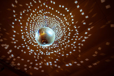 Low angle view of illuminated chandelier