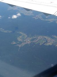 Aerial view of landscape seen through airplane window