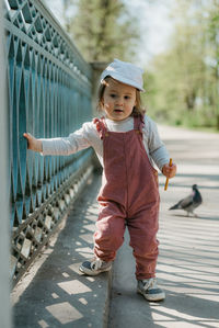 Full length of boy standing on street