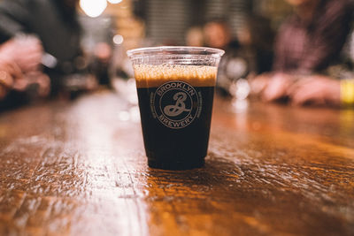 Close-up of beer glass on table