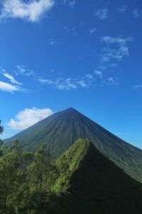 View of volcanic landscape against blue sky