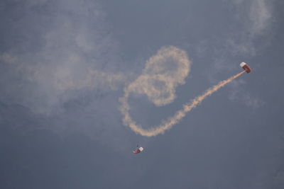 Low angle view of airplane flying in sky