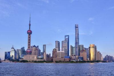 Buildings in city against sky