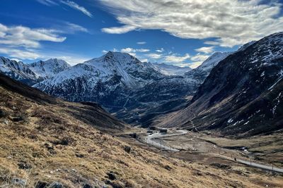 Scenic view of snowcapped mountains against sky