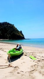 Kayaking pit stop for delicous tom yam souo by the beach against clear blue sky