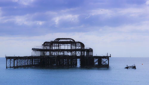 Pier over sea against sky