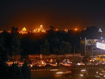 Illuminated amusement park at night