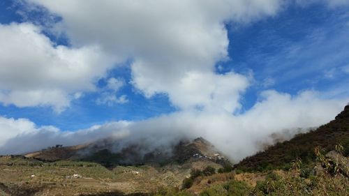 Scenic view of land against sky