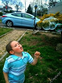 Boy playing on grass