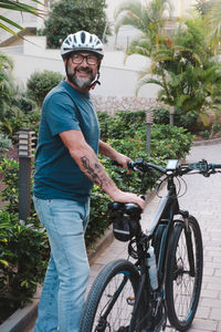 Man riding bicycle on street