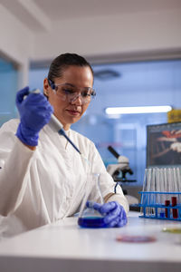 Portrait of doctor examining medicine in laboratory