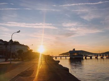 View of bridge over river against sky during sunset