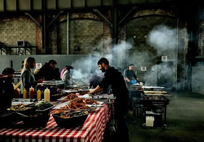 Group of people at market stall