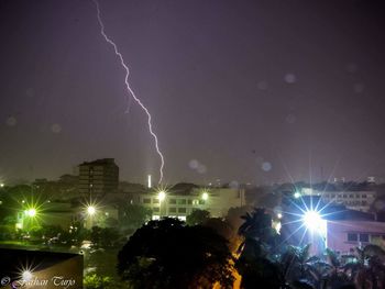 Lightning over city at night