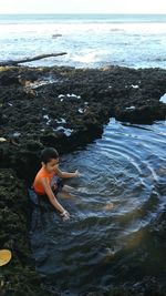 Boy playing at beach