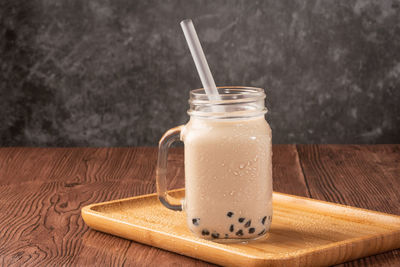 Close-up of drink in jar on table