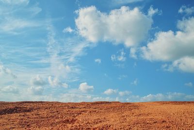 Scenic view of field against blue sky