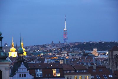 View of buildings in city against clear sky