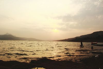 Scenic view of sea at sunset