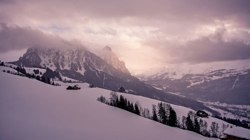 Scenic view of snowcapped mountains against sky