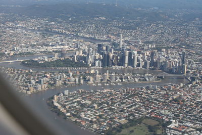 Aerial view of buildings seen through airplane window