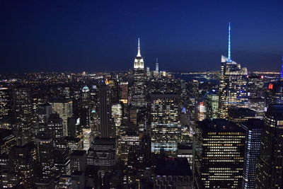 Illuminated buildings in city at night