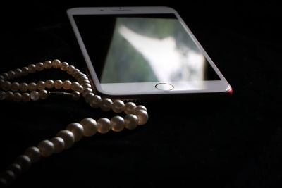 Close-up of mobile phone on table