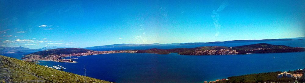 High angle view of bay against clear blue sky