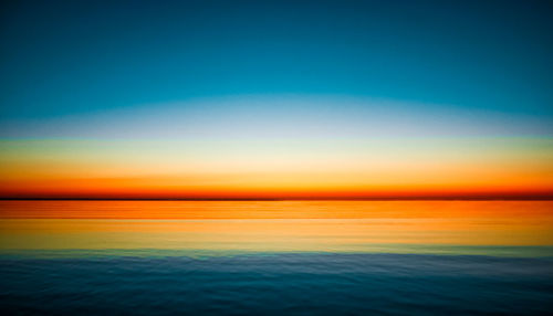 Scenic view of sea at sunset