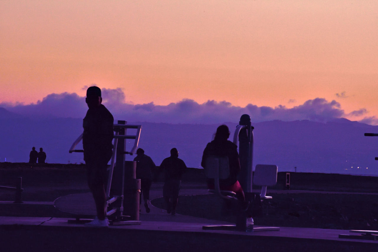 SILHOUETTE PEOPLE AGAINST ORANGE SKY DURING SUNSET