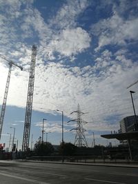 Low angle view of electricity pylon against sky