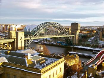 High angle view of bridge over river against cloudy sky