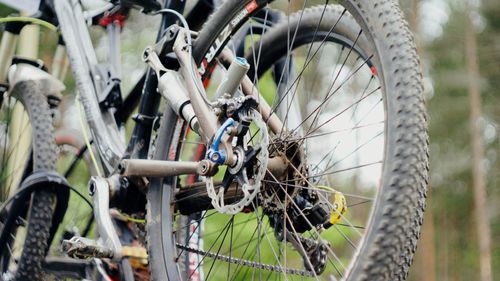 Close-up of bicycle parked against blurred background