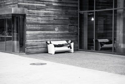 View of two people lying on floor against buildings