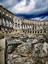 View of old ruins against cloudy sky