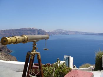 Telescope against the sea and island